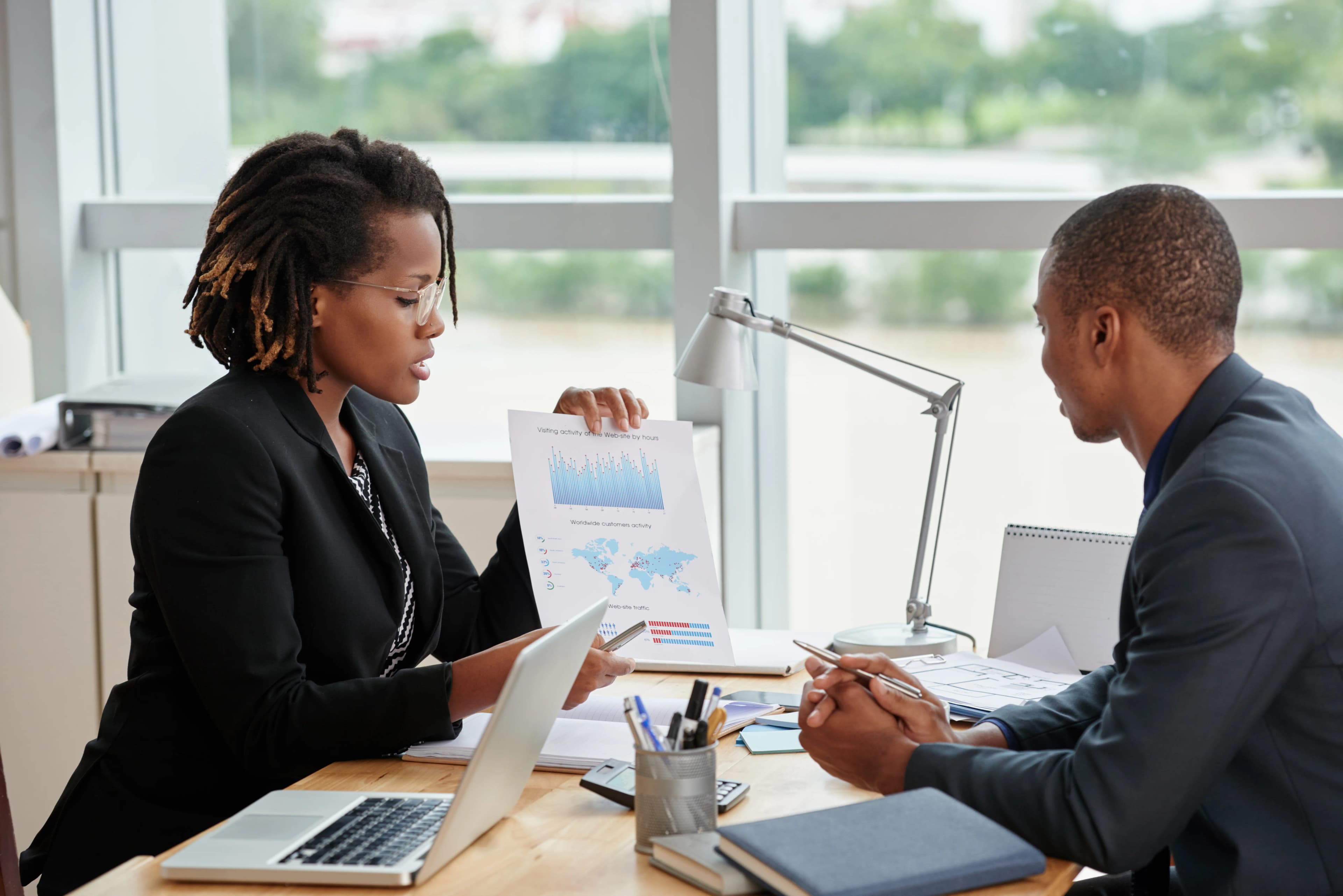 a staff in office with a client