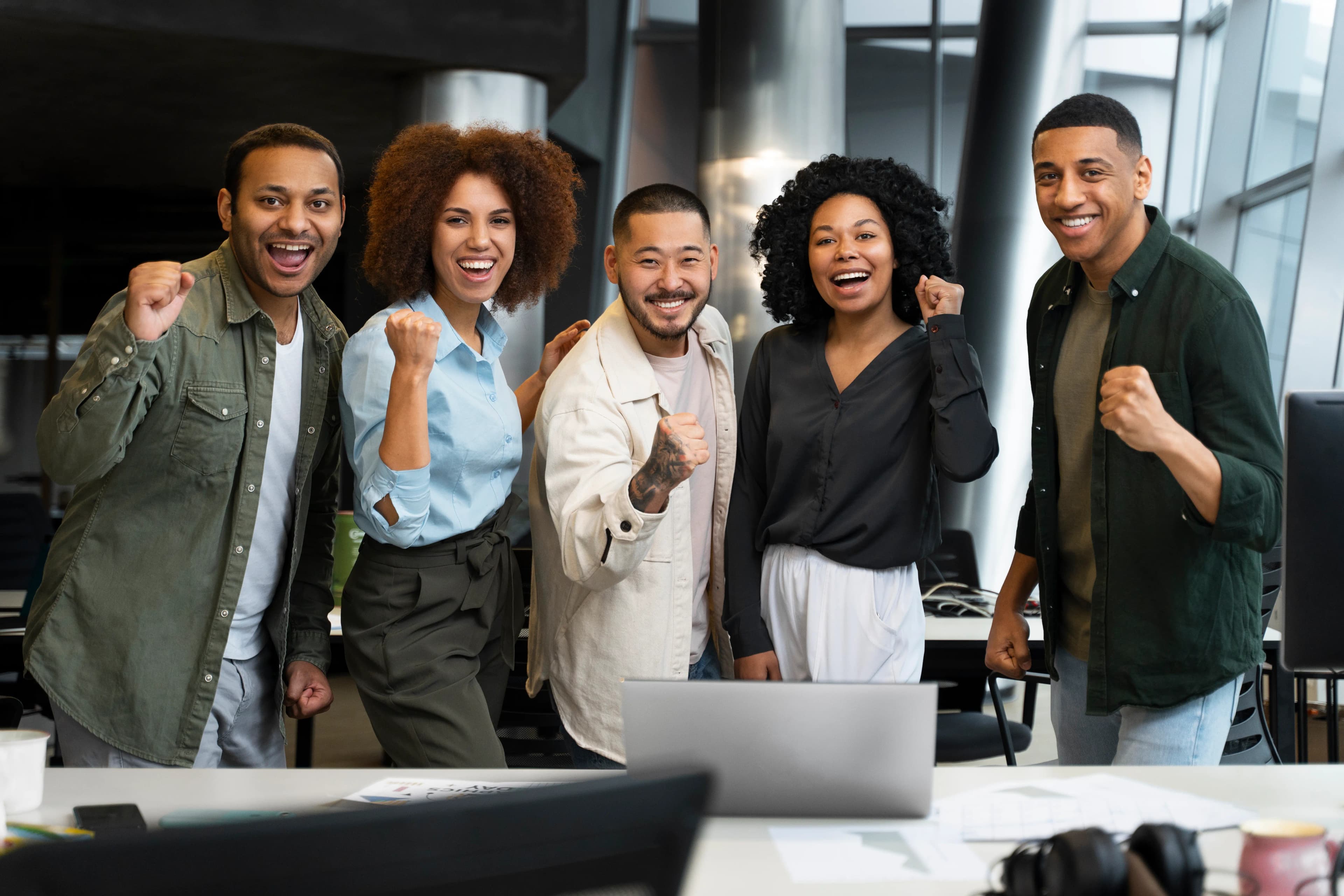 team posing in an office